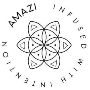 AMAZI Sacred Tea Bottles with Flower of Life Design Two AMAZI glass tea bottles with Flower of Life engraving on blue bench, filled with fresh herbs and lemon water, surrounded by ritual tools including wooden spoon and sacred geometry cards